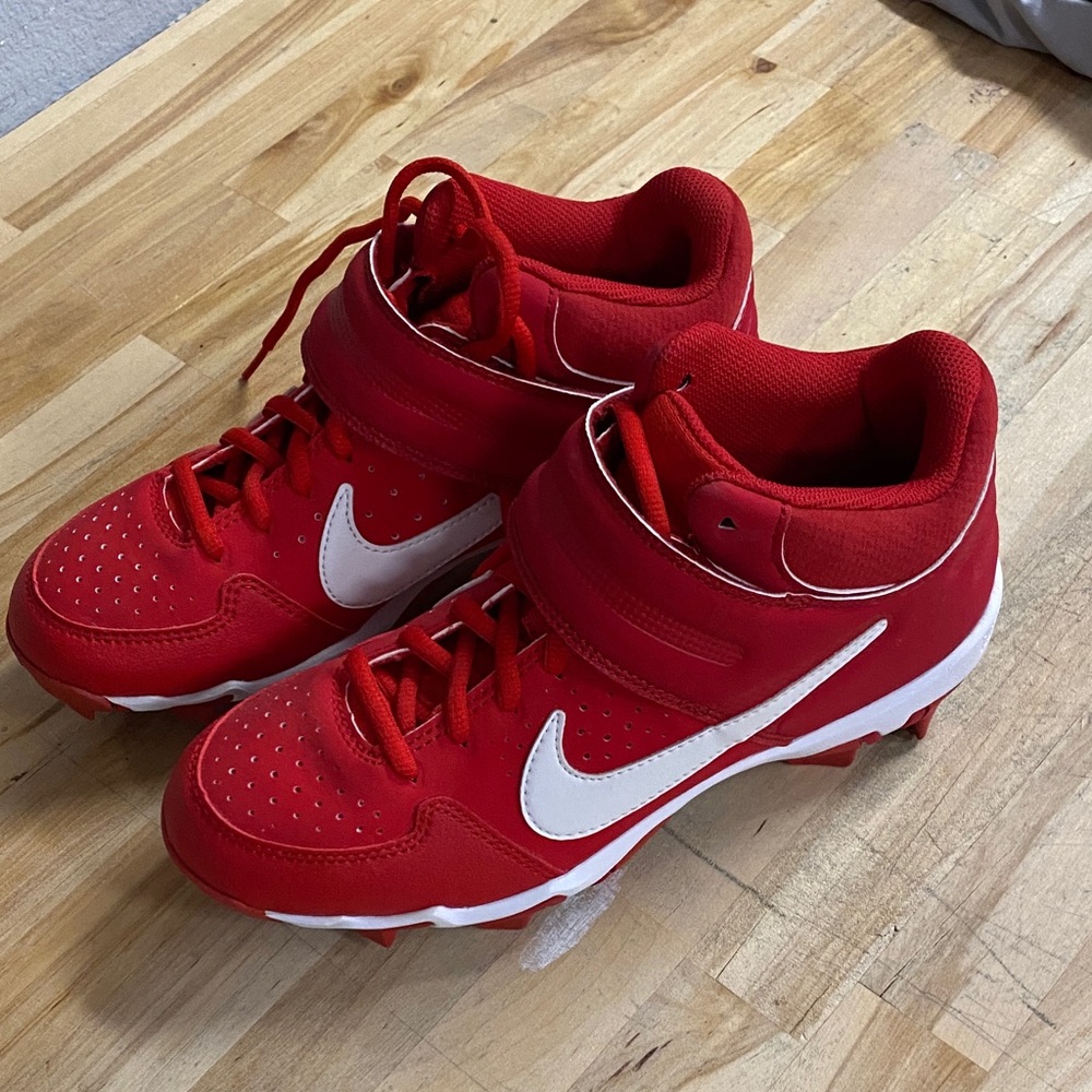 Nike Kids Red Cleats with White Swoosh Strap kids size 5.5 
Like new